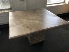 A square Barker and Stonehouse travertine dining table