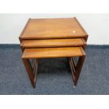 A nest of three mid 20th century teak G-plan tables