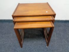 A nest of three mid 20th century teak G-plan tables