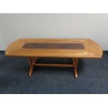 A mid 20th century G-plan refectory coffee table with leather inset panel
