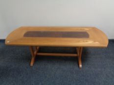 A mid 20th century G-plan refectory coffee table with leather inset panel