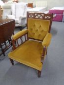 An Edwardian gentleman's armchair in buttoned dralon