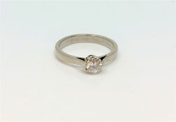 An 18ct gold solitaire diamond ring, approx. 0.