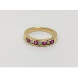 An 18ct gold ruby and diamond ring, size J CONDITION REPORT: 2.