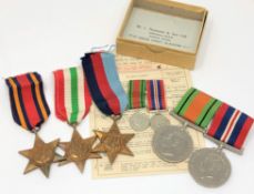 Five unnamed WWII medals with paperwork,