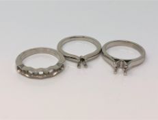 Three vacant platinum ring mounts (3) CONDITION REPORT: 15.