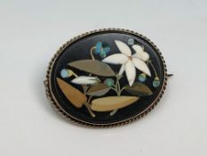 An oval pietra dura brooch in gold frame