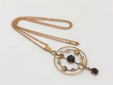 An antique gold pendant on gold chain