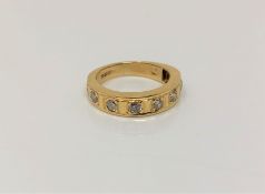 An 18ct gold diamond set half eternity ring, approx. 0.