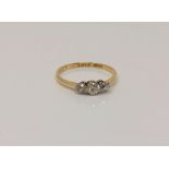 An 18ct gold three stone diamond ring, size O CONDITION REPORT: 1.