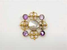 A gold, amethyst and mother of pearl brooch CONDITION REPORT: Apparently unmarked. 4.