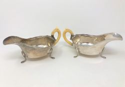 A pair of silver sauce boats with ivory handles, Emile Viner,