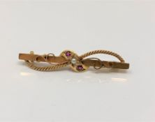 A 15ct gold ruby and pearl bar brooch CONDITION REPORT: 3.