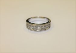 An 18ct white gold ring set with 54 princess cut diamonds CONDITION REPORT: Lot 147