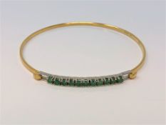 An 18ct gold emerald set bracelet CONDITION REPORT: 5.