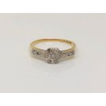 An 18ct gold diamond cluster ring, size M CONDITION REPORT: 2.