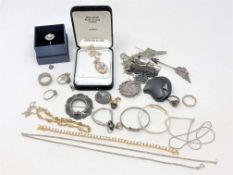 A group of silver and other jewellery including an opal ring, brooches, pendants,