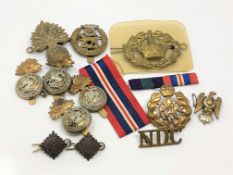 A collection of medals and badges including four Northumberland Fusiliers examples