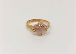 An antique 15ct gold moonstone ring,