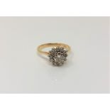 An 18ct gold diamond cluster ring, the central stone approx. 0.