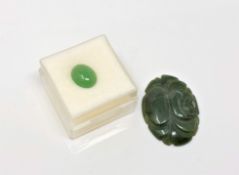 Two pieces of jade; one carved, one cabochon (2) CONDITION REPORT: Largest 3cm long.