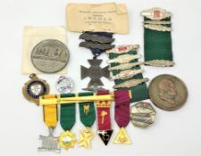 A group of medals and badges including silver RAF badge,