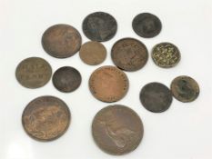 An 1885 farthing, halfpenny tokens 1800 and 1813, 1858 penny, New Brunswick halfpenny 1843,