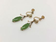 A pair of yellow metal jade drop earrings with screw-backs