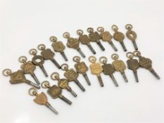 22 various pocket watch keys,