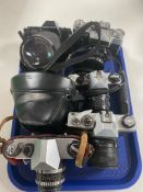 A tray containing 6 vintage cameras to include Pentax, Zenit E,