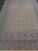 A machine made Tekke design carpet on beige ground