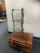 Two graduated wicker baskets together with a metal three tier pan stand (a/f)