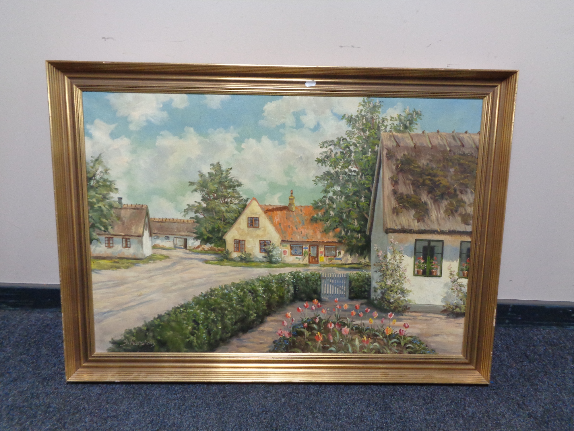 A gilt framed continental school oil on canvas, rural village, signed S.