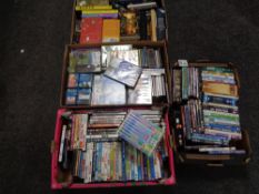 Four boxes of assorted DVDs, computer games, Peppa Pig box set,