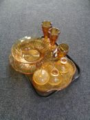 A tray containing twentieth century amber glassware to include five piece trinket set, vases, bowl,