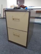 A two drawer metal filing cabinet with key