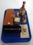 A tray containing leather cased card set, World War I postcard, boxed orchid letter opener,