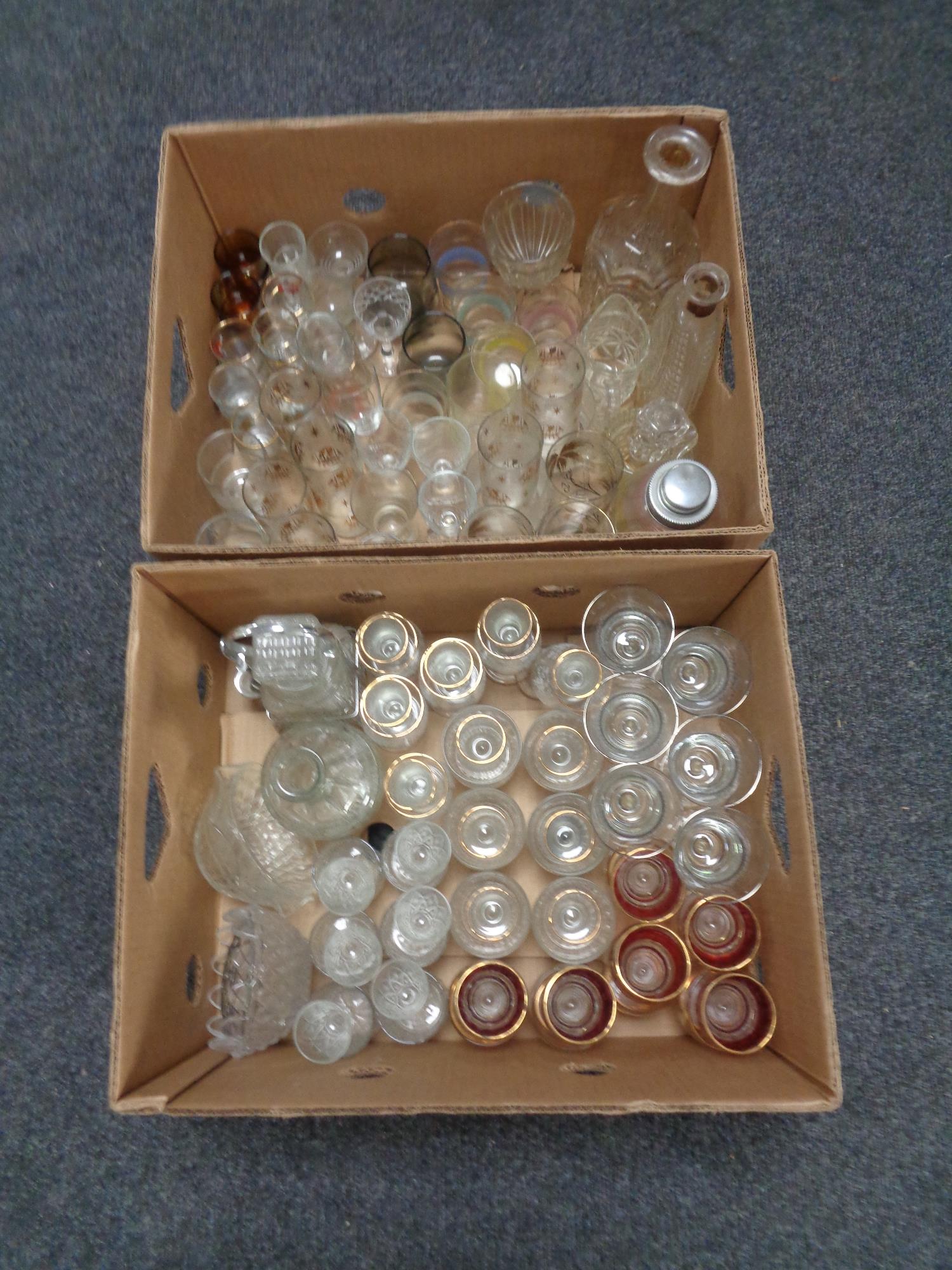 Two boxes containing 20th century glassware