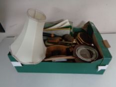 A box containing petit point dressing table brush sets, mid twentieth century mantel clock,