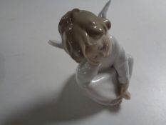 A Lladro figure of a cherub