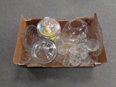 A box of assorted glassware to include kitchen storage jars,