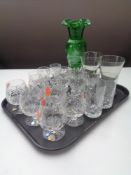 A tray containing assorted drinking glasses together with an antique green glass vase with hand