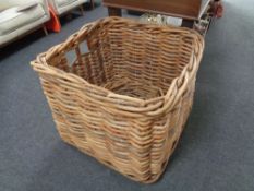 A large square wicker log basket with a further wicker basket