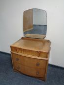 A twentieth century oak three drawer dressing chest