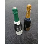 A bottle of Audinot Grand Cru champagne together with a further bottle of Cava