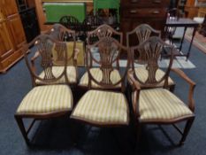 A set of six mahogany Hepplewhite style dining chairs, two carvers,