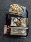 A tray containing costume jewellery, including beaded neck;aces, bracelets, simulated pearls,