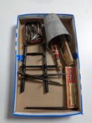 A box containing antique fountain pens, a pen stand with boxer dog head mounts,