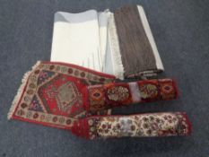 A box containing five assorted rugs