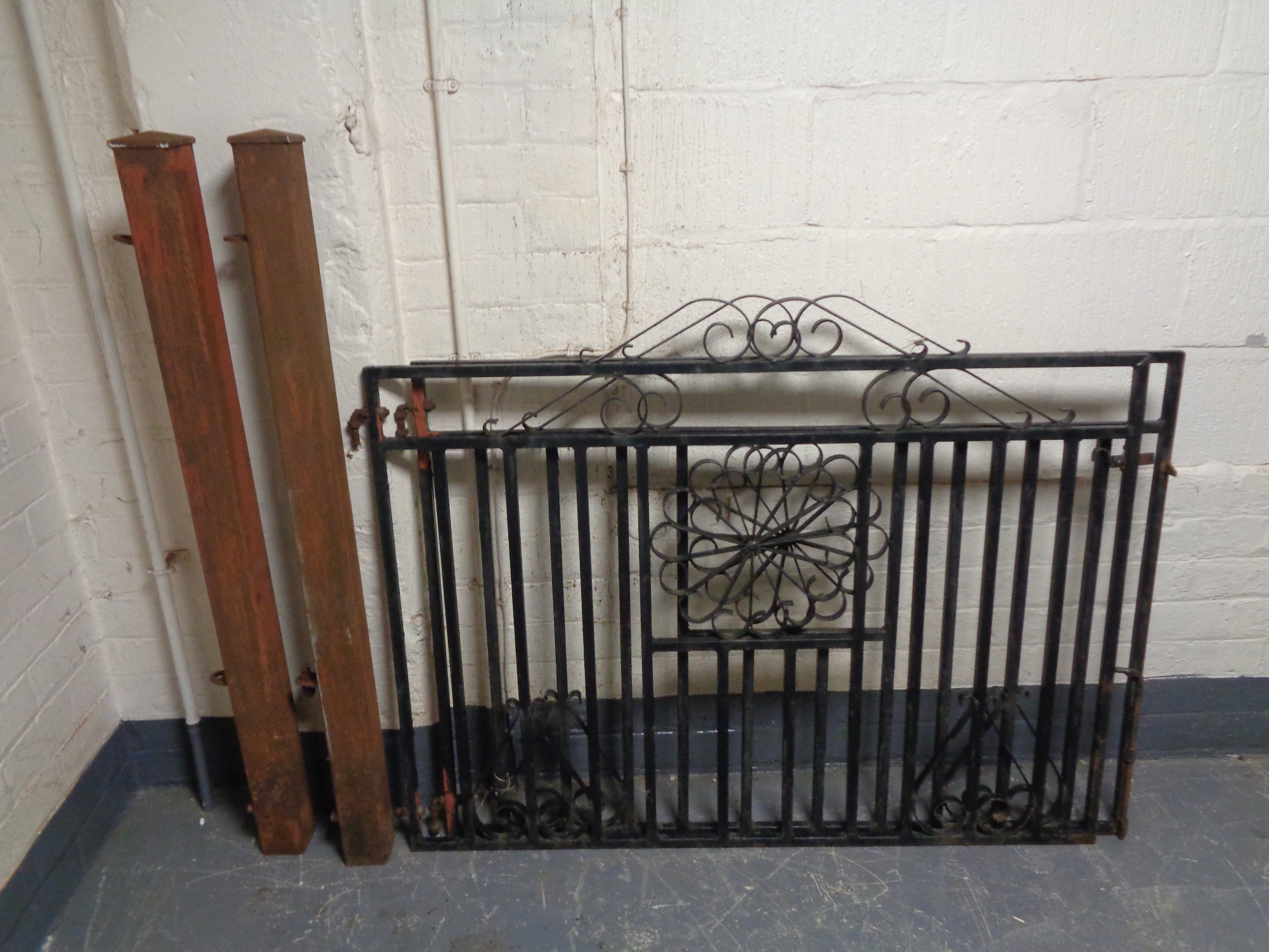 A pair of wrought iron gates with gate posts